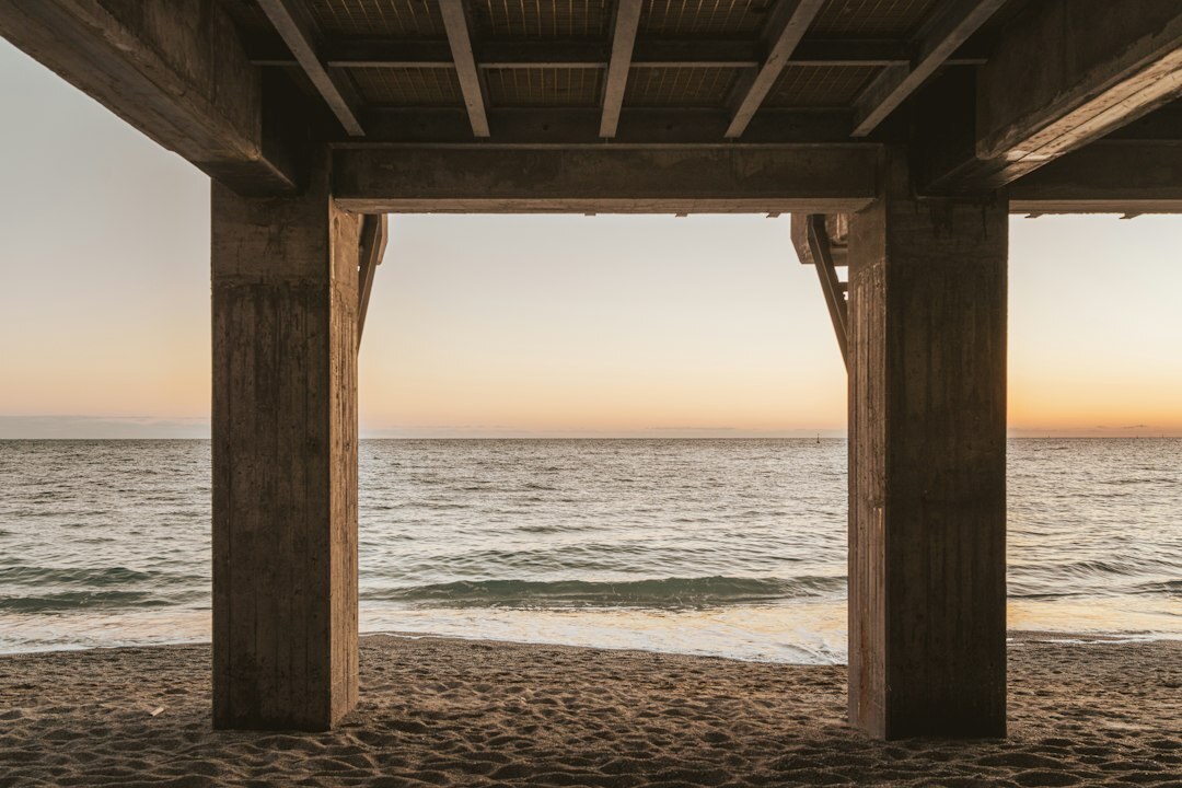 Minimalist coastal architecture with wooden pergola